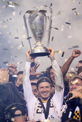 David Beckham lifts the 2011 MLS Cup 