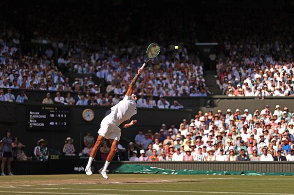 Nick Kyrgios serves v Novak Djokovic Centre Court Wimbledon 2022
