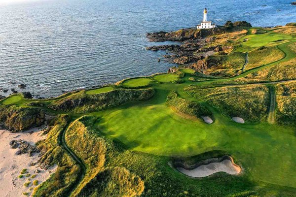 Aerial view 8th & 9th holes with lighhouse behind Ailsa Course Turnberry Resort 2021