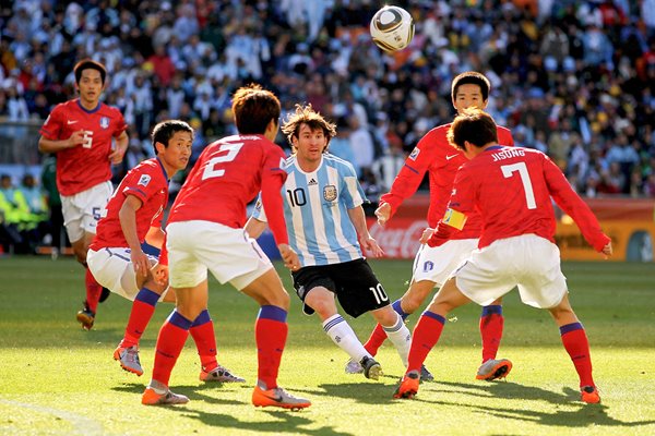 Lionel Messi srrounded v South Korea
