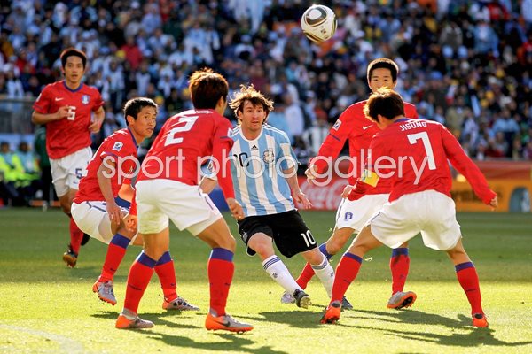 Lionel Messi srrounded v South Korea
