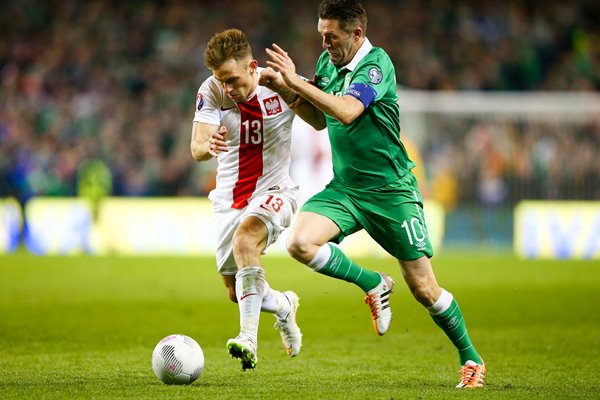 Robbie Keane Ireland v Maciej Rybus Poland