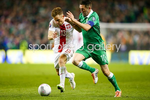 Robbie Keane Ireland v Maciej Rybus Poland
