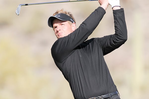 Luke Donald of England plays his tee shot WGC 2011