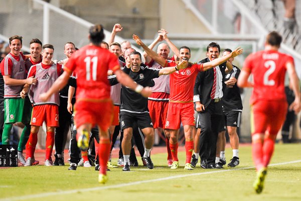 Gareth Bale celebrates with Wales teammates