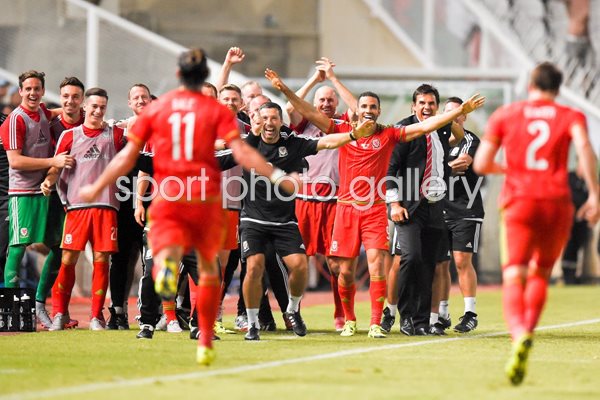 Gareth Bale celebrates with Wales teammates
