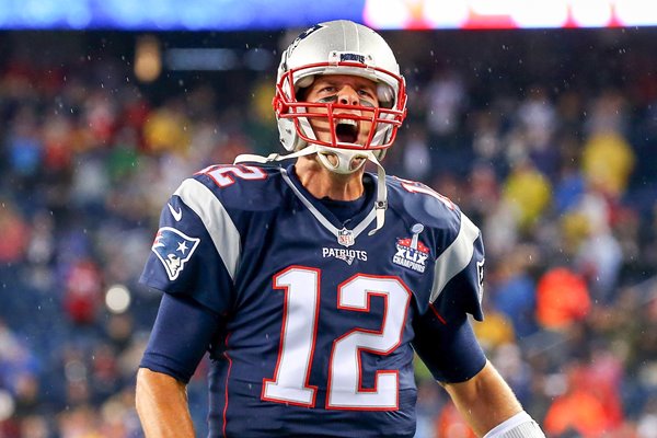 Tom Brady New England Patriots cheers as he runs