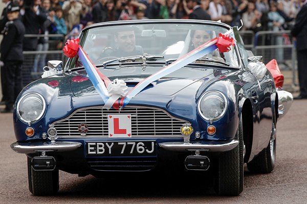 Royal Wedding Photos - Couple leave in sports car