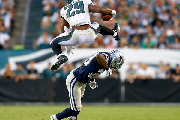 DeMarco Murray leaps over Brandon Carr