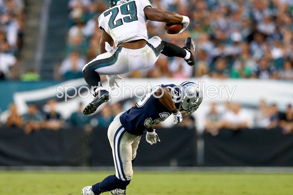 DeMarco Murray leaps over Brandon Carr
