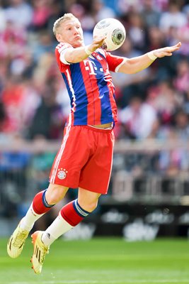 Bastian Schweinsteiger Bayern chests the ball