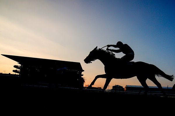  Runner climbs the hill Cheltenham Festival 