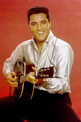 Elvis Presley plays guitar
