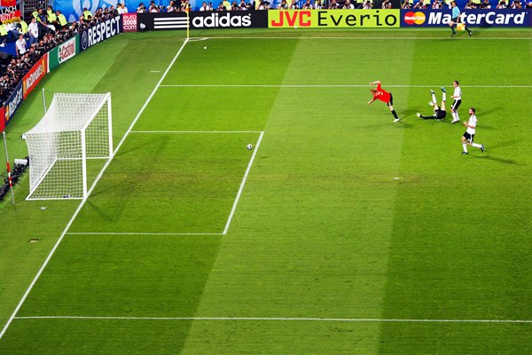 The ball heads towards goal from Torres