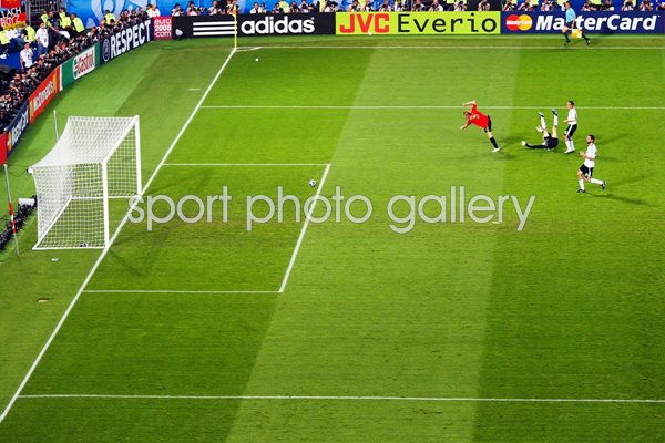 The ball heads towards goal from Torres