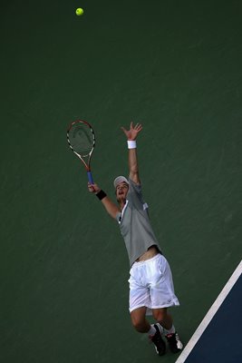 Andy Murray serves with power in the final.