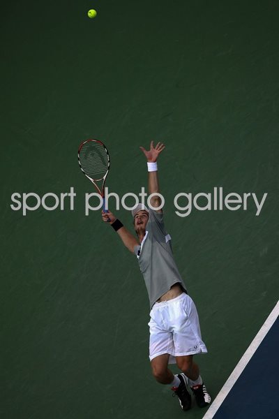 Andy Murray serves with power in the final.