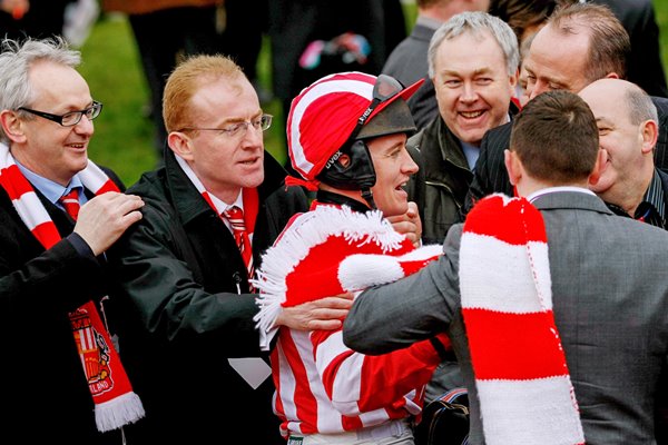 Brian Geraghty and owners celebrate Cheltenham 2009