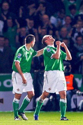 Feeney of Norhtern Ireland celebrates his goal