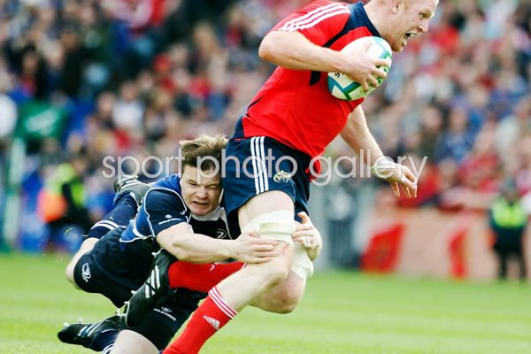 Paul O'Connell tackled by Brian O'Driscoll