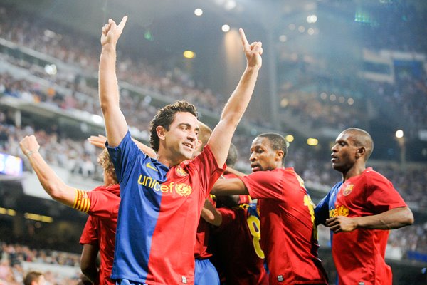 Xavi and Barcelona players celebrate goal