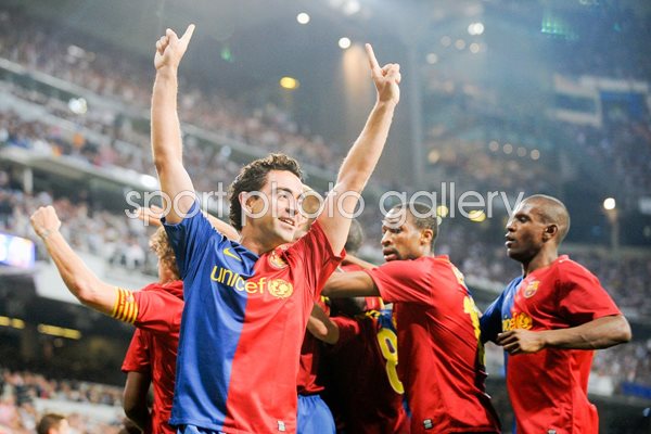 Xavi and Barcelona players celebrate goal