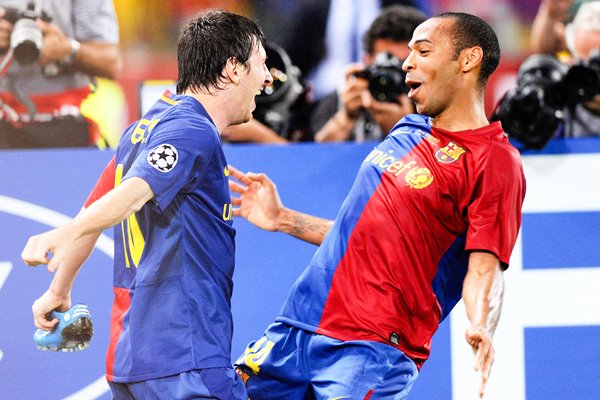 Messi celebrates with Henry after scoring for Barcelona