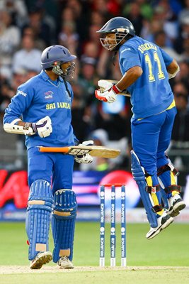 Jehan Mubarak of Sri Lanka encourages teammate