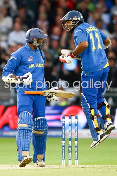 Jehan Mubarak of Sri Lanka encourages teammate