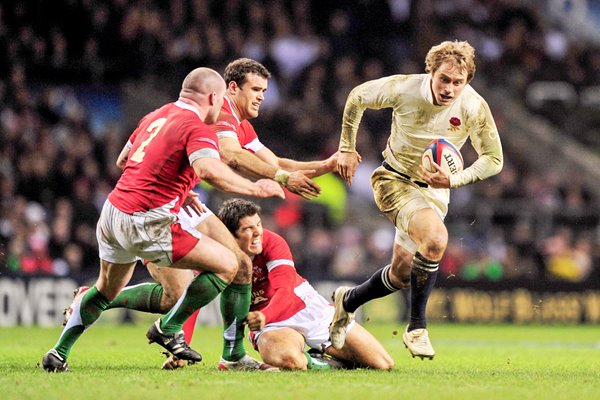 Matthew Tait breaks through Wales defence