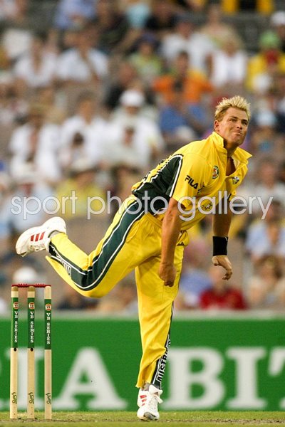 Shane Warne of Australia bowls