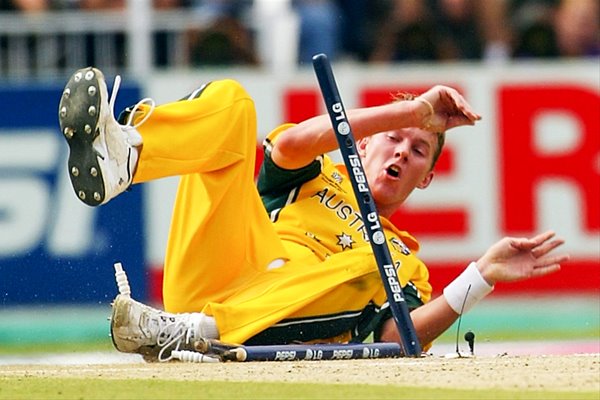 Brett Lee crashes through the stumps