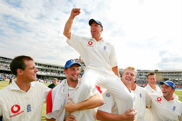 Alec Stewart on his team-mates shoulders