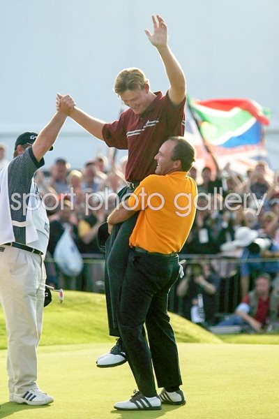 Thomas Levet  lifts champion Ernie Els