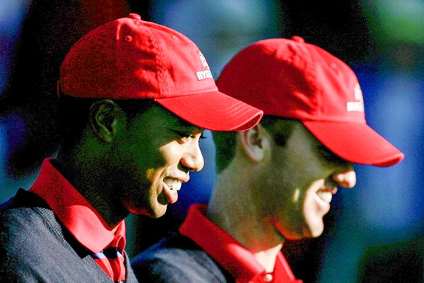 Tiger Woods and Chris Riley