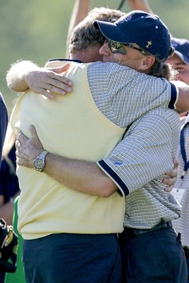 Bernhard Langer hugs Colin Montgomerie 