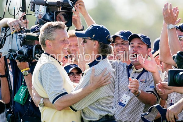 Bernhard Langer hugs Colin Montgomerie 