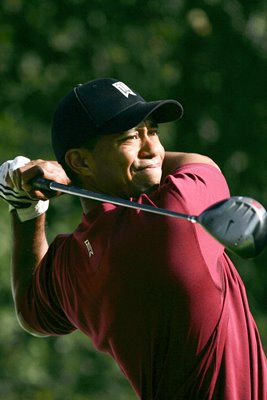 Tiger Woods hits a tee shot 