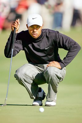 Tiger Woods stalks a putt