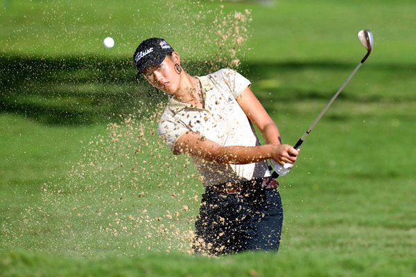 Michelle Wie hits out of a bunker 