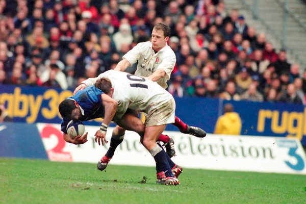 Emke D'Tamack is tackled by Jonny Wilkinson