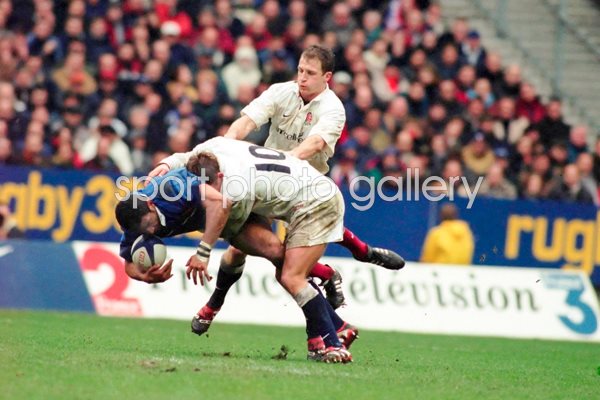 Emke D'Tamack is tackled by Jonny Wilkinson