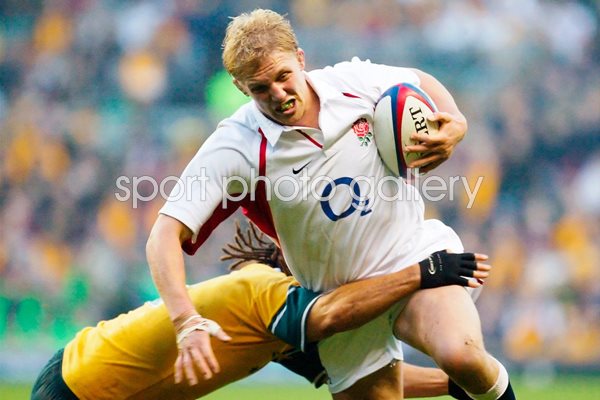 Lewis Moody is tackled by George Smith 