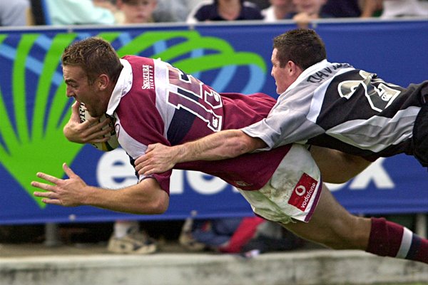 Chris Latham of Queensland dives over 