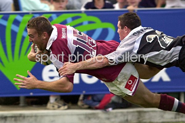 Chris Latham of Queensland dives over 