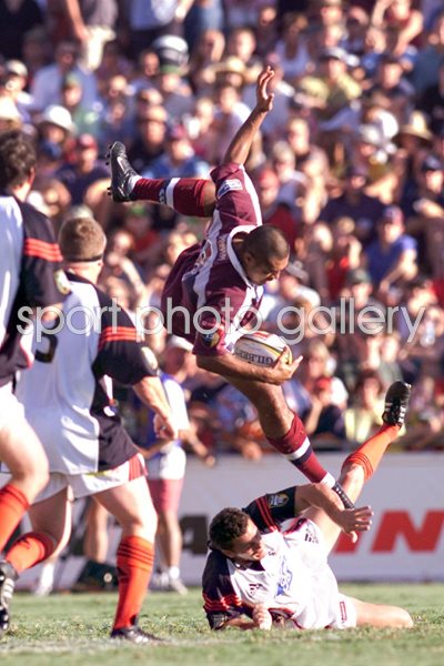 Toutai Kefu #8 of the Reds takes a high ball 