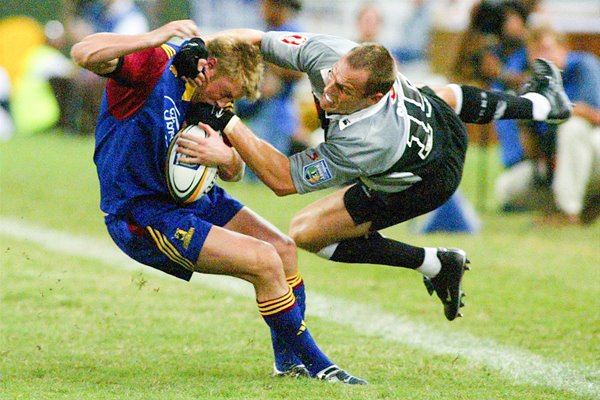 Paul Steinmetz of the Highlanders tackled by Justin Swart