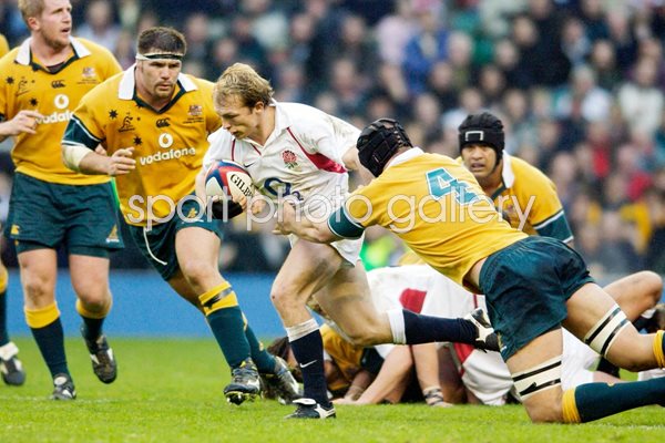 Matt Dawson of England breaks through the Australian defence