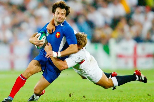 Christophe Dominici tackled by Jonny Wilkinson