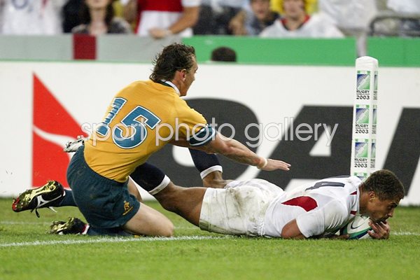 Jason Robinson of England dives over for a try